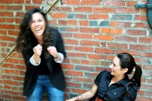Morgan and business partner Christin Martinelli share a moment of laughter in a warehouse turned venue in Georgetown.